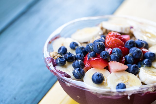 berries and bananas in a bowl