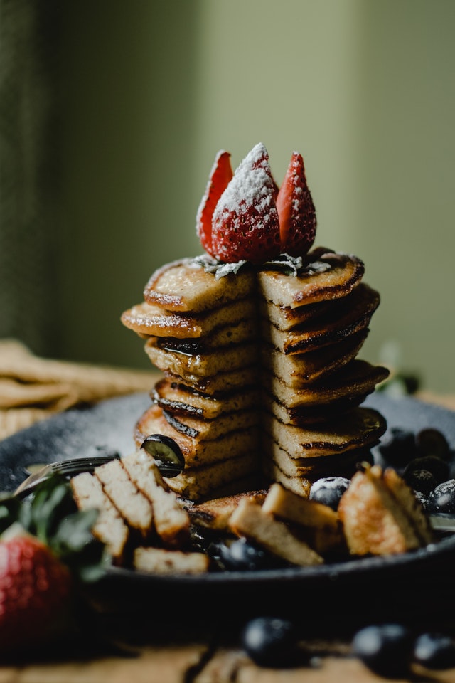 pancakes cut in half and strawberries